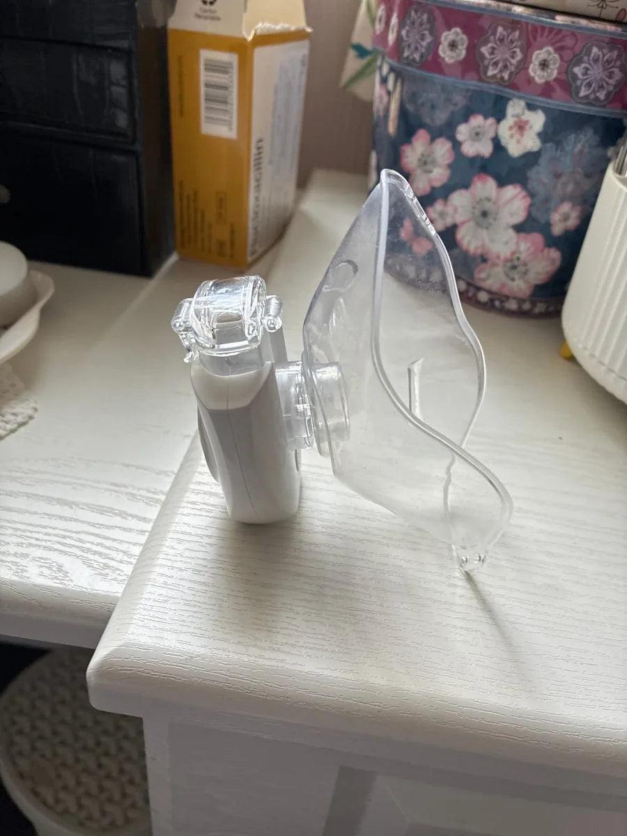 Portable nebulizer with clear mask attachment