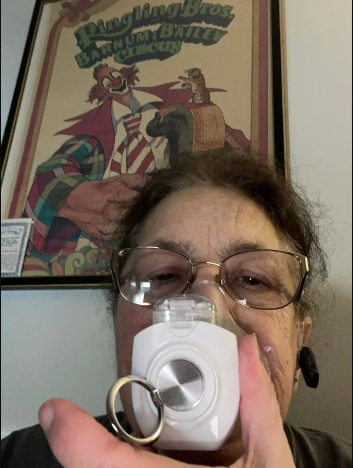 Denise Z. using a portable nebulizer
