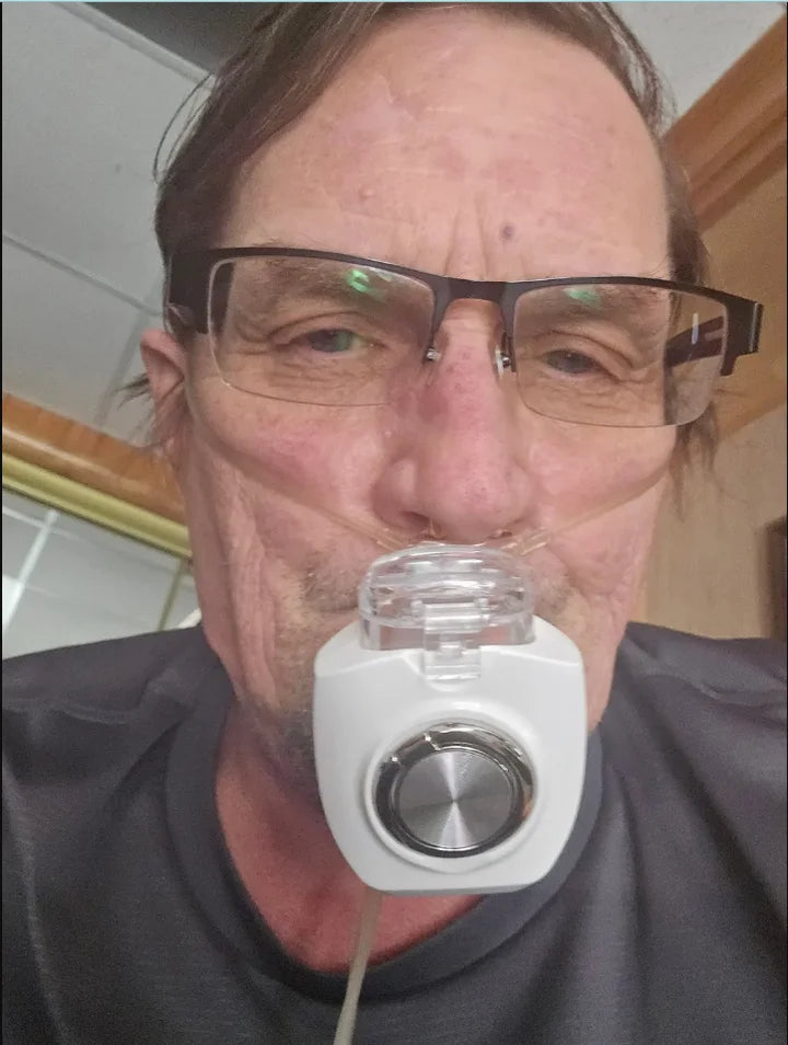 Michael W. using a portable nebulizer